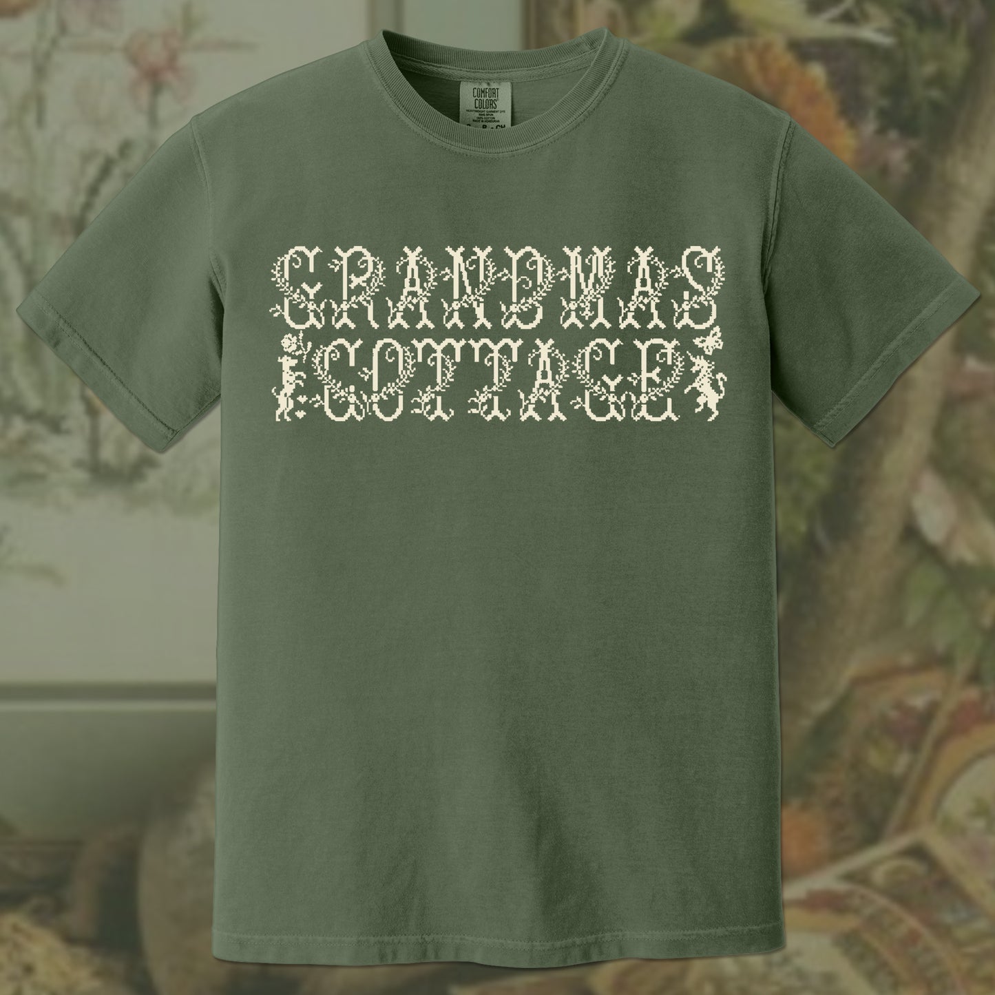 Hemp green t-shirt with 'GRANDMA'S COTTAGE' text on a floral background