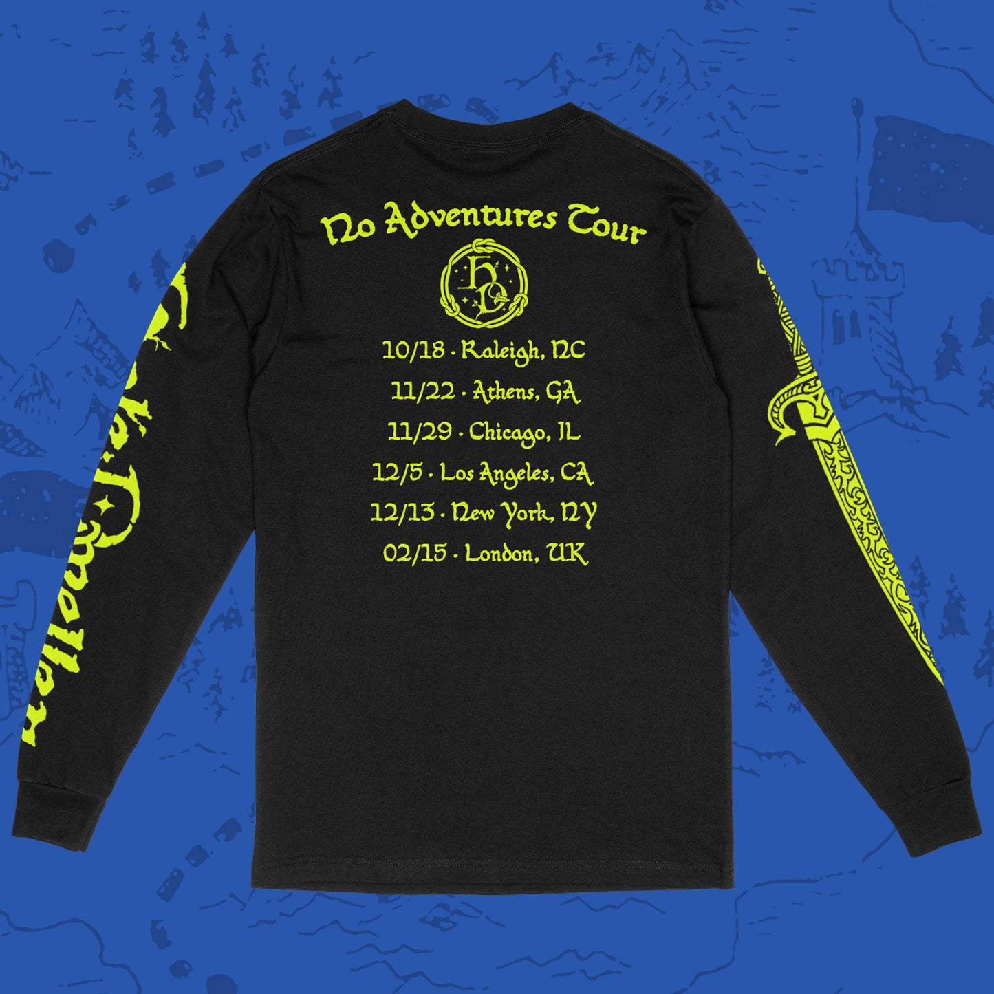 Back of a black long-sleeve Gildan shirt with 'Hole Dweller' 2026 tour dates printed in neon yellow on a blue backdrop.