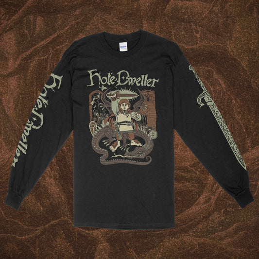 Black long-sleeve Gildan shirt with 'Hole Dweller' graphic design featuring a hobbit holding a sword to the sky. The right sleeve reads Hole Dweller vertically, the left sleeve features a sword. The image is printed in tan, green and brown. The shirt is against a brown textured backdrop.