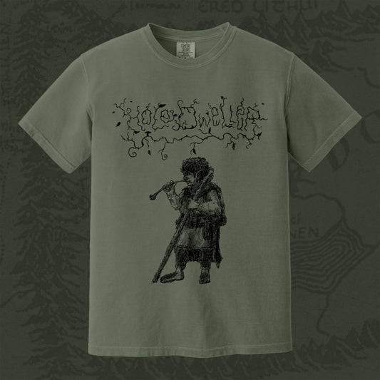 Hole Dweller "flies the coop I" T-Shirt printed in black ink on a dark moss green shirt. The graphic shows the Hole Dweller logo, and a hobbit smoking a pipe.