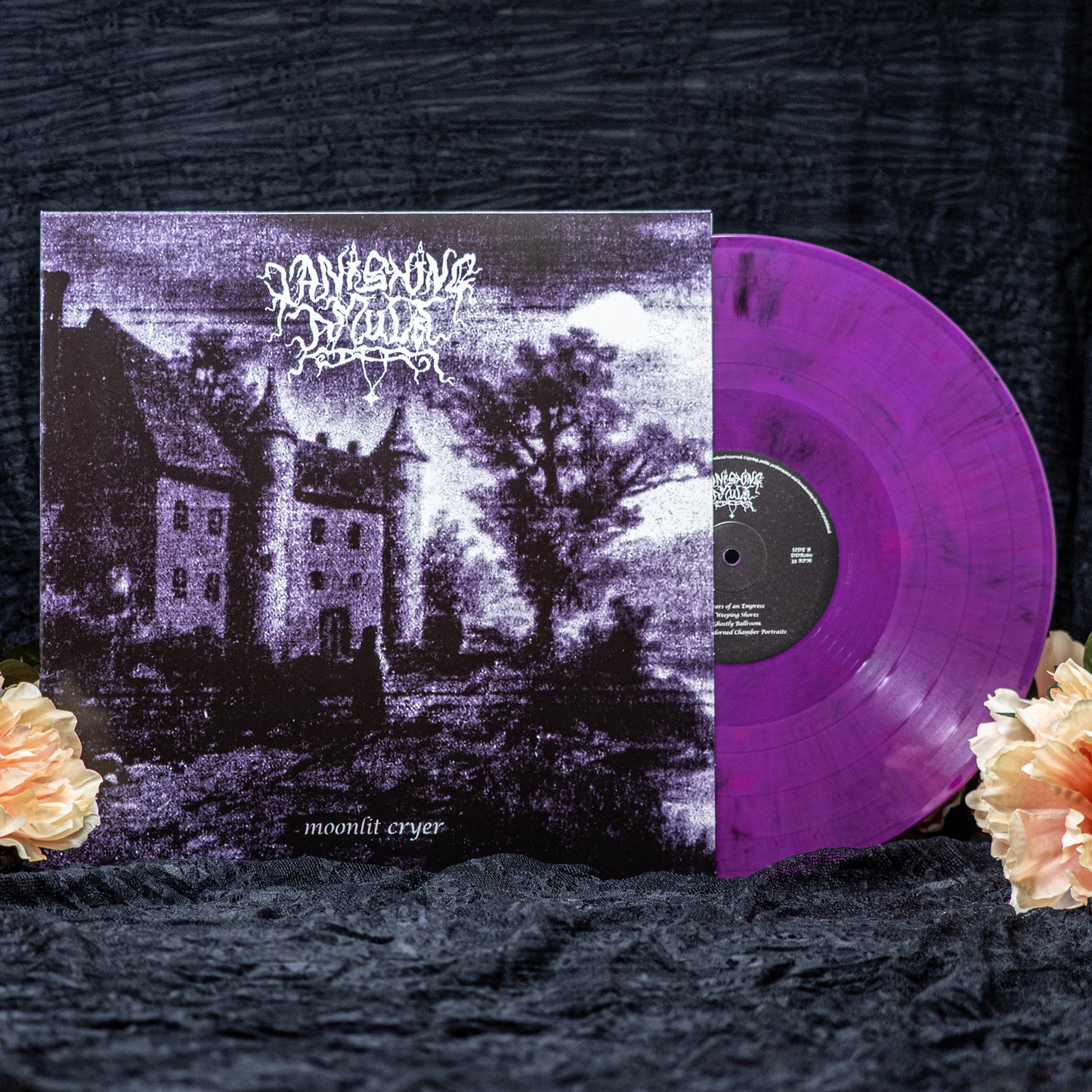 Vanishing Amulet "Moonlit Cryer" Swirl Purple vinyl record in standard purple. The cover shows a lonely man in front of a castle at night. Set against a black backdrop with flowers.