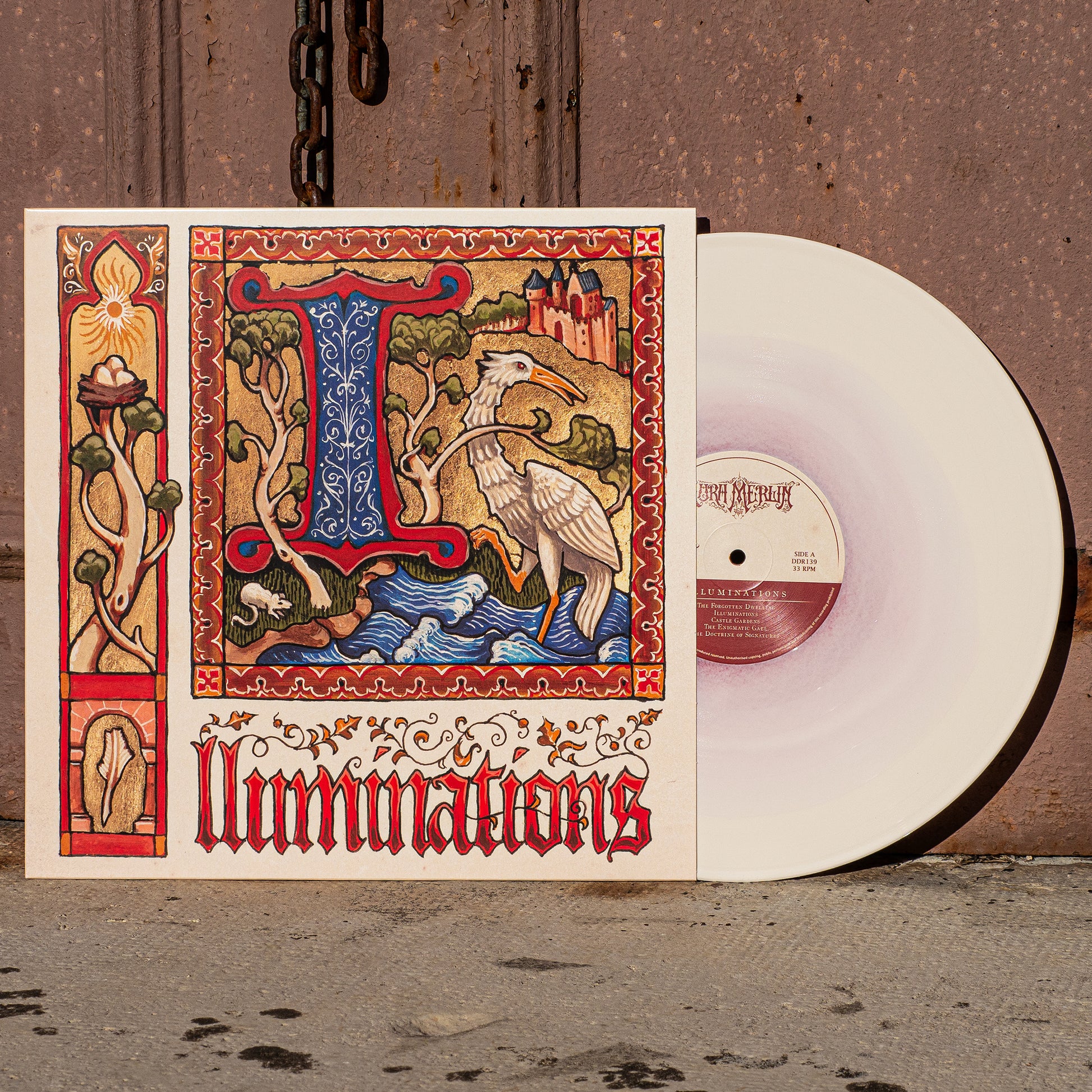A vinyl record titled 'Illuminations' by Aura Merlin with a colorful album cover featuring a intricate design and a bird-like figure in a fantasy landscape.