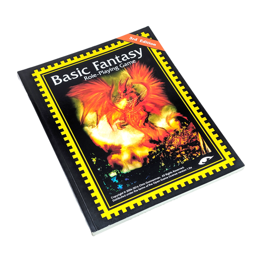 Basic Fantasy Role-Playing Game 3rd Edition book cover, featuring a fiery red and orange dragon illustration on a black background with a yellow border, photographed on a white background.