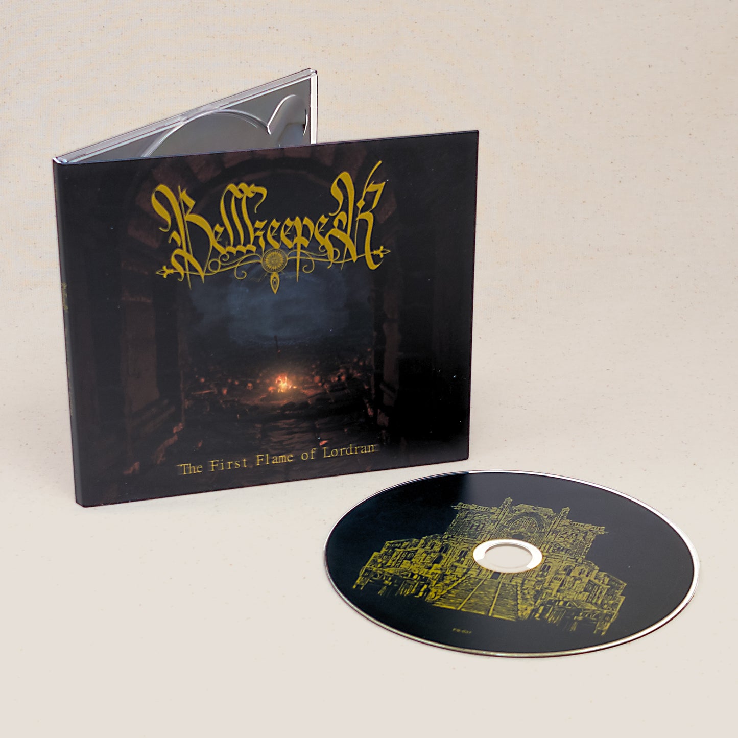 CD of Bellkeeper's First Flame of Lordran sitting next to the CD case with graphics of a sword in a fire.