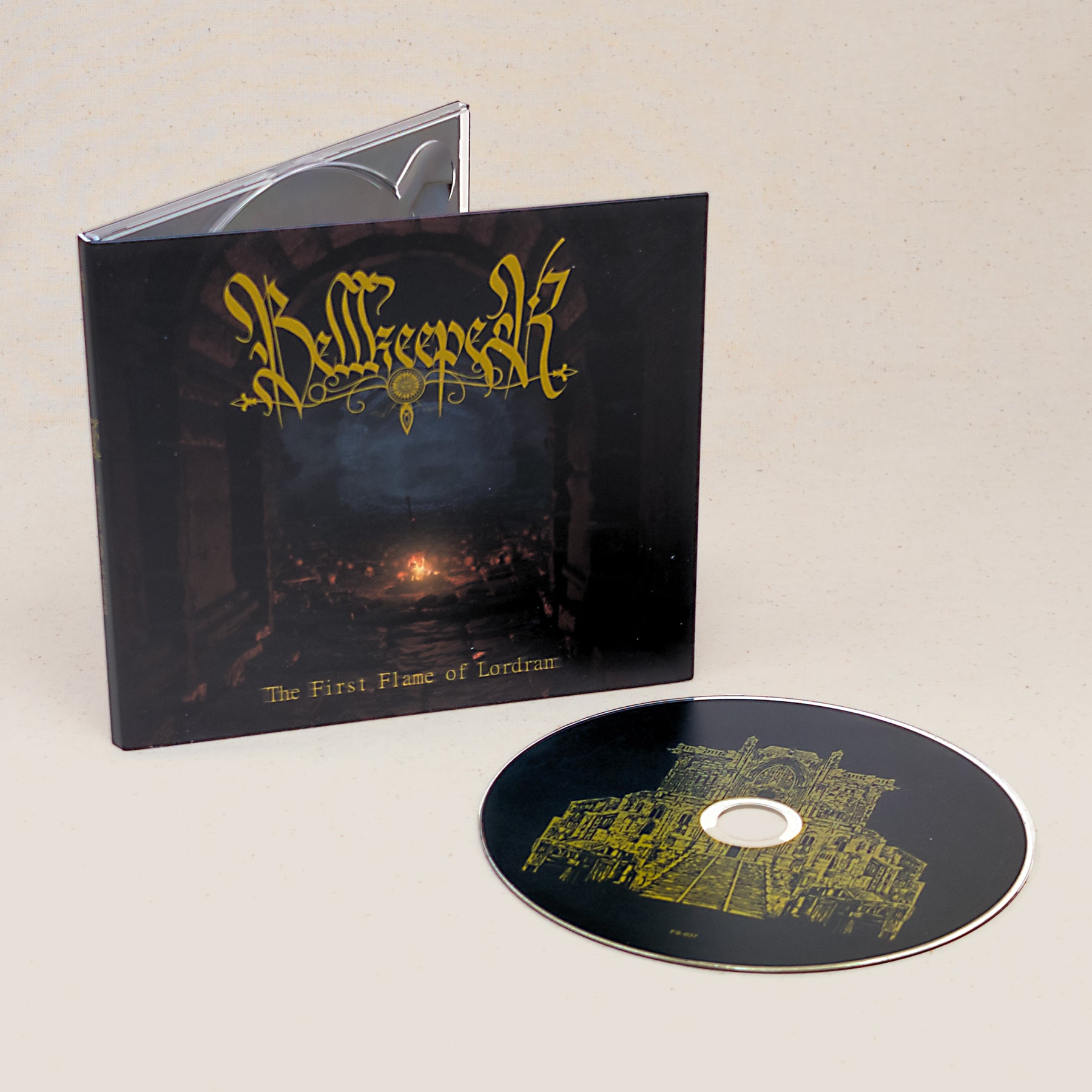 CD of Bellkeeper's First Flame of Lordran sitting next to the CD case with graphics of a sword in a fire.