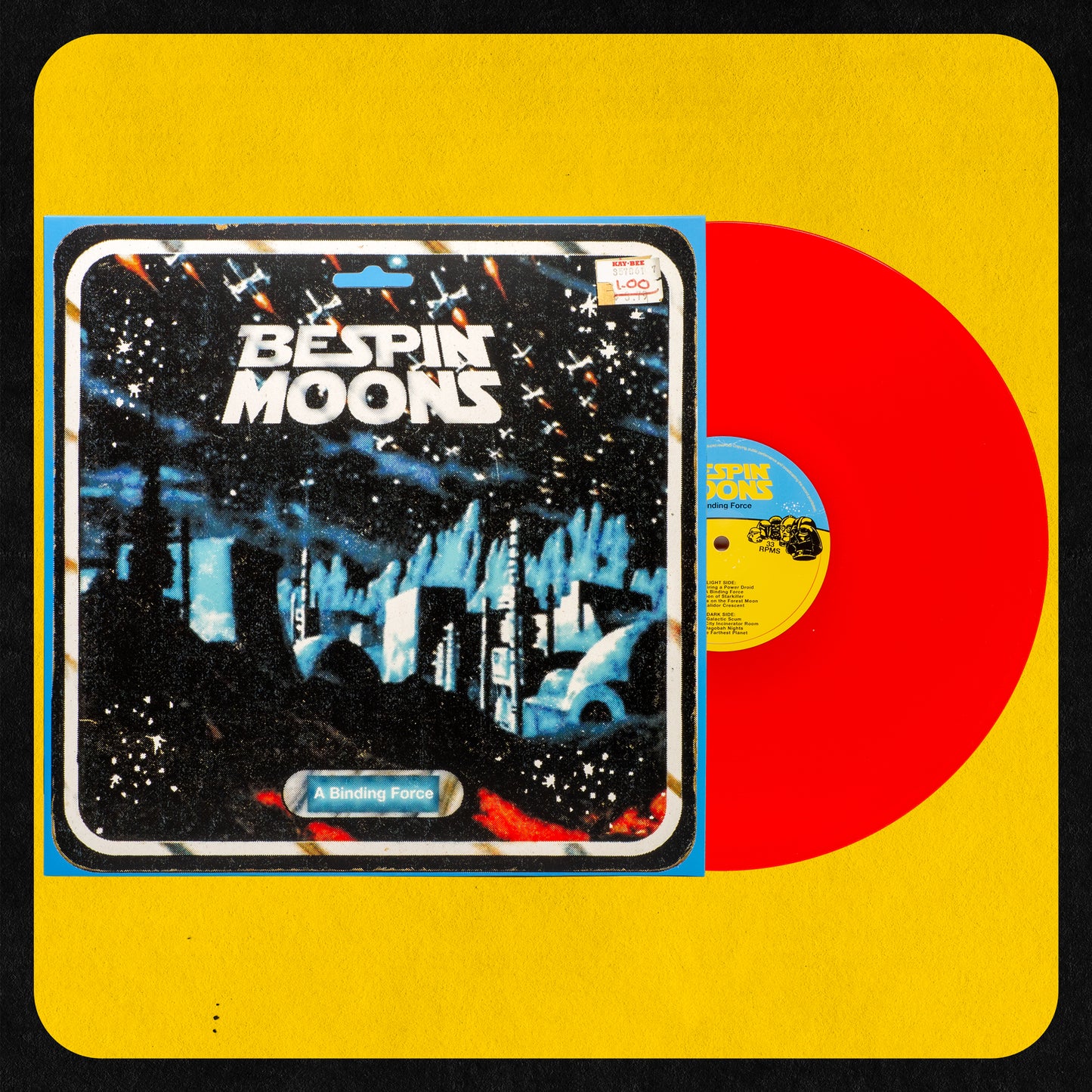 A vinyl record titled 'Bespin Moons A Binding Force' with a stylized cover featuring a star wars theme at night and the album title in bold letters. The record is transparent red.