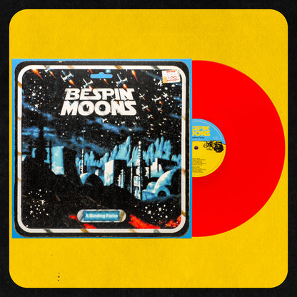 A vinyl record titled 'Bespin Moons A Binding Force' with a stylized cover featuring a star wars theme at night and the album title in bold letters. The record is transparent red.
