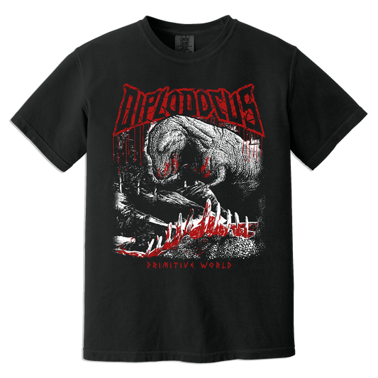 A black short-sleeve graphic t-shirt featuring a large red and white print of a dinosaur with sharp teeth feasting on prey and the word 'DIPLODOCUS' in a distressed red font across the chest. Below the shirt reads "Primitive World"