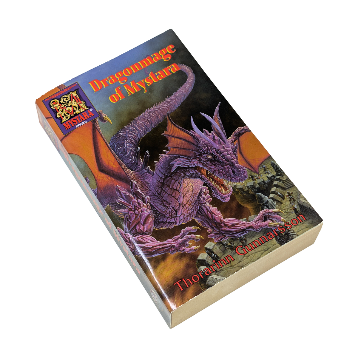 Paperback book with image of a purple dragon set against a white background with the tesxt Dragonmage of Mystara by Thorarinn Gunnarsson