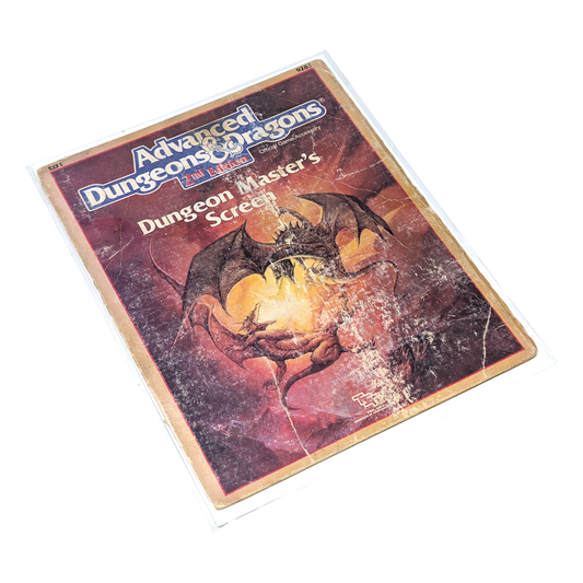 A vintage Dungeons & Dragons Dungeon Masters Screen with two dragons battling on the cover in distressed condition