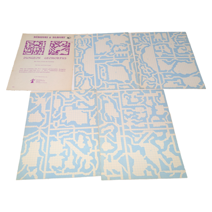 A vintage board game set titled 'Dungeon & Dragons' and 'Dungeon Geomorphs' shown with its instruction booklet and two large game boards featuring a light blue and off-white maze-like grid pattern, photographed on a white background.