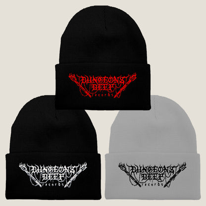 Three Dungeons Deep Records logo beanies in different colors: black with red stitching, gray with black stitching, and black with white stitching, all featuring an embroidered logo on the front.