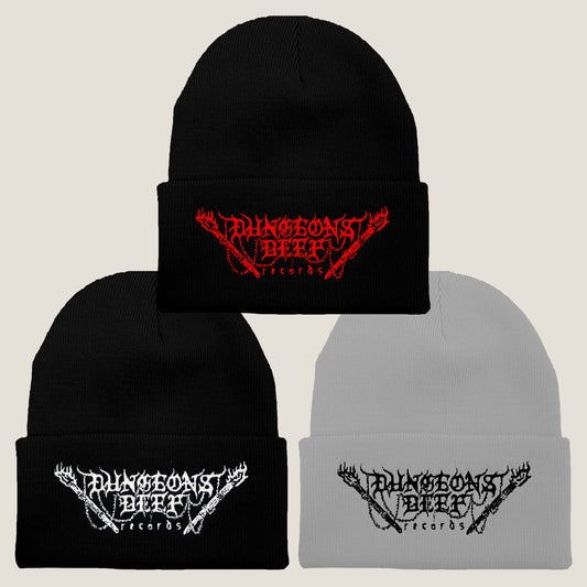 Three Dungeons Deep Records logo beanies in different colors: black with red stitching, gray with black stitching, and black with white stitching, all featuring an embroidered logo on the front.