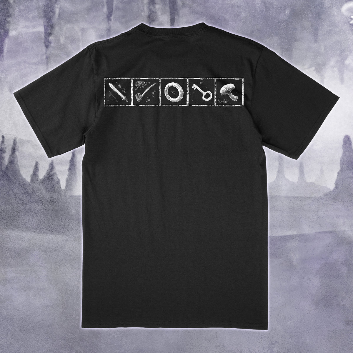 A black short-sleeve t-shirt shown from the back, featuring a white graphic print of four square panels containing a sword, a pipe, a ring, and a mushroom. The shirt is displayed against a moody, misty gray background.