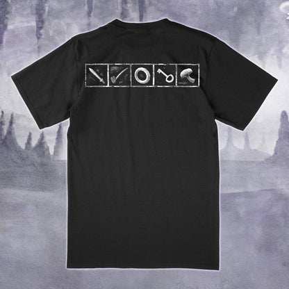 A black short-sleeve t-shirt shown from the back, featuring a white graphic print of four square panels containing a sword, a pipe, a ring, and a mushroom. The shirt is displayed against a moody, misty gray background.