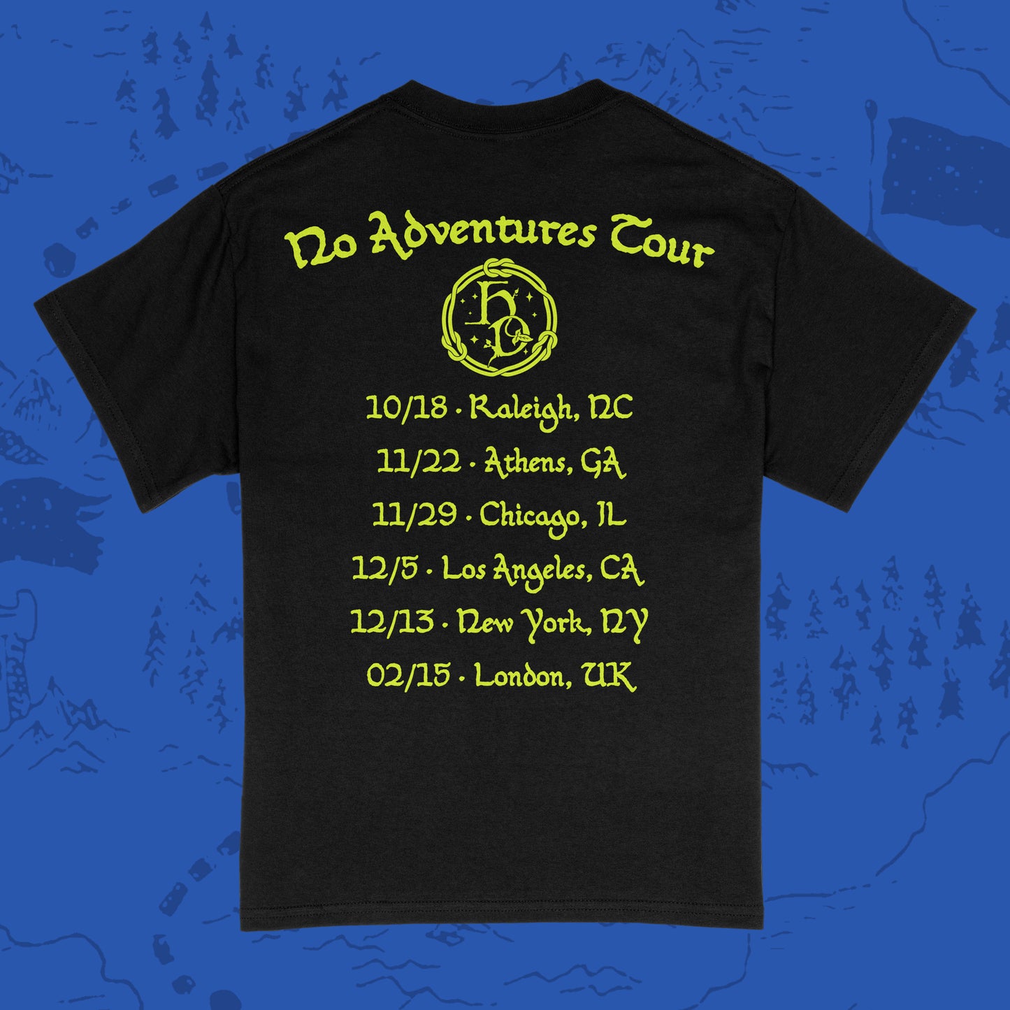 Back of a black short-sleeve Gildan shirt with 'Hole Dweller' 2026 tour dates printed in neon yellow on a blue backdrop.