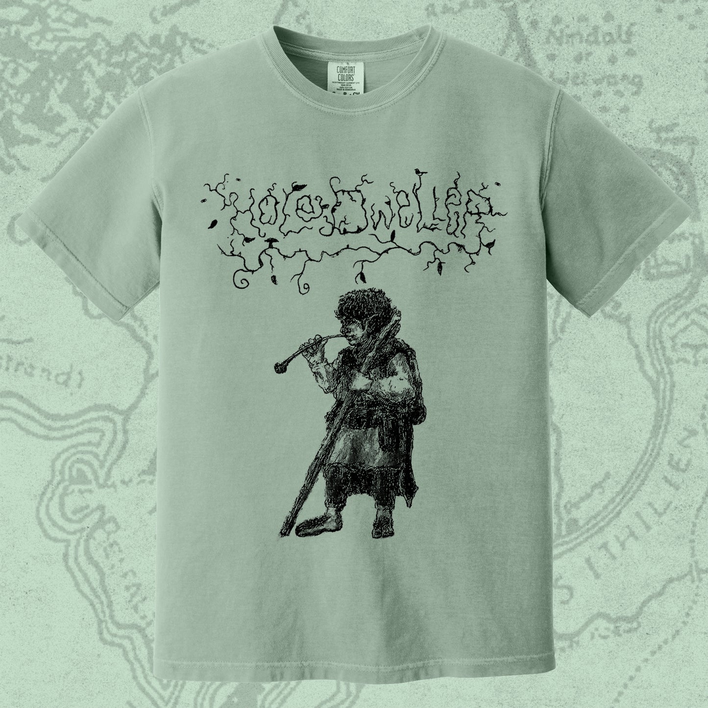 Hole Dweller "flies the coop I" T-Shirt printed in black ink on a light green shirt. The graphic shows the Hole Dweller logo, and a hobbit smoking a pipe.