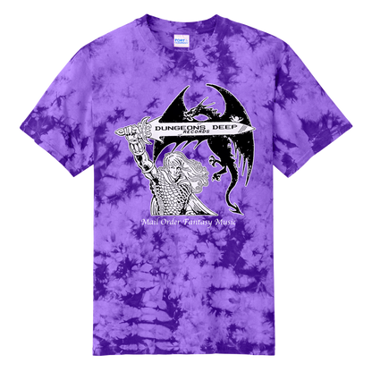 A purple tie dye shirt featuring 'Mail Order Fantasy Music' text and illustrations screen printed on the front. The design depicts a man holding a sword with the words "Dungeons Deep Records" inscribed next to a fantasy dragon.