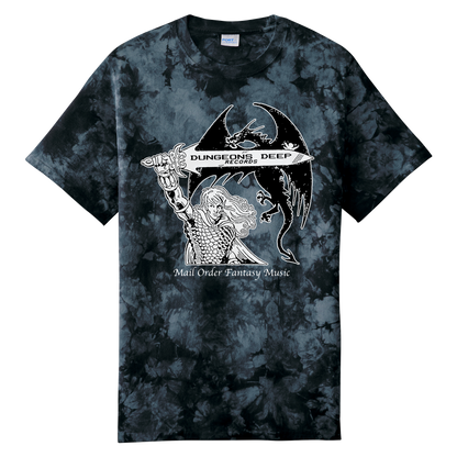 A black tie dye shirt featuring 'Mail Order Fantasy Music' text and illustrations screen printed on the front. The design depicts a man holding a sword with the words "Dungeons Deep Records" inscribed next to a fantasy dragon.