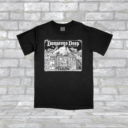 Black T-shirt with 'Dungeons Deep Records' text and a graphic of a a mystical landscape on the front.