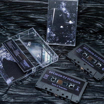 A set of black cassette tapes and a clear plastic case arranged on a dark textured surface. The tape labels read 'Poisons of Eleanor' and 'Lord of Lavender', with one cassette showing side B text and another showing the album art cover.