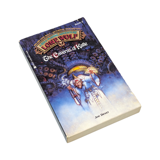 A single paperback book titled "The Caverns of Kalle" from the "Lone Wolf" series by Joe Dover, shown at an angle on a plain white background. The cover features fantasy artwork with a blue and purple cosmic background and a central figure in white robes.